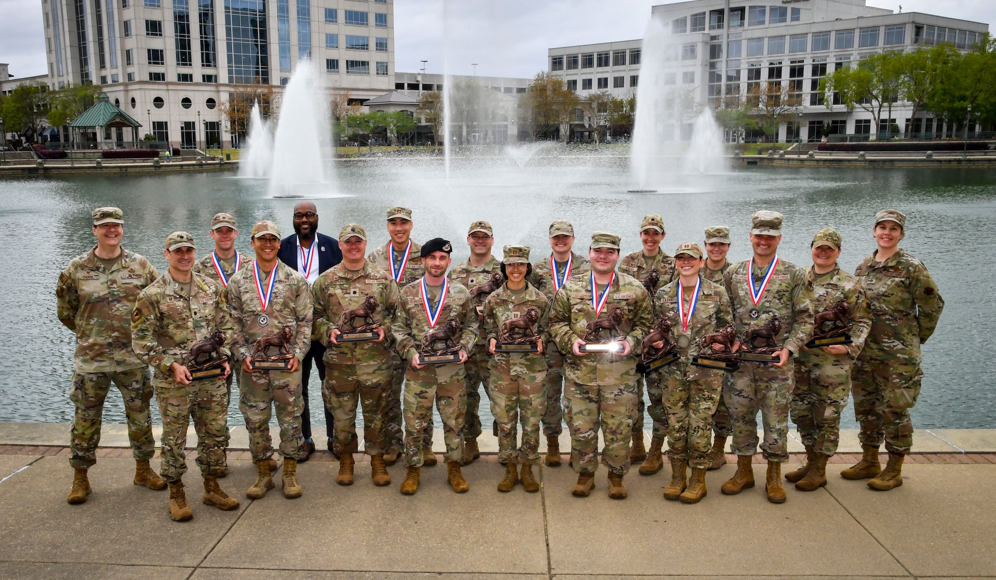 Winners pose for a group photo with their awards.