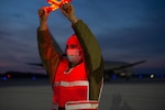 Staff Sgt. Joshua Poticha, a crew chief assigned to the 157th Maintenance Group, New Hampshire Air National Guard, marshals the 157th Air Refueling Wing’s 11th KC-46A tanker, Pease Air National Guard Base, New Hampshire, Dec. 11, 2020.