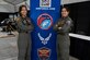 Morgan and Montana Montayre, Aim High Flight Academy 2023 students, visit the United States Air Force booth at Sun N Fun in Lakeland, Fla. on April 10. The USAF booth provided attendees with Air Force swag and the opportunity to fly fighter jets in the flight simulator. (U.S. Air Force Photo by Staff Sgt. Alexis Suarez)