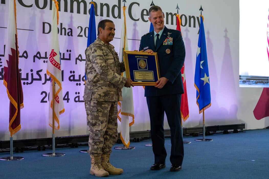 Lt. Gen. Alex Grynkewich, former commander of Ninth Air Force (Air Forces Central), accepts a gift from Chief of Staff of Qatar Armed Forces Lt. Gen. Salem bin Hamad bin Aqeel Al-Nabet, during a change of command ceremony at Al Udeid Air Base, Qatar, April 18, 2024. Grynkewich took command in July 2022, and has been selected to serve as the Director of Operations on the Joint Staff in Washington, D.C. (U.S. Air Force photo)