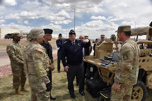 Sgt. Jesse De La Torre, 1st Space Brigade, U.S. Army Space and Missile Defense Command, briefs Chief of Space Operations U.S. Space Force Gen. Chance Saltzman and Chief Master Sgt. of the Space Force John F. Bentivegna on a tactical space control system during a visit to the brigade headquarters at Fort Carson, Colo., April 10. (U.S. Army photo by Dottie White)
