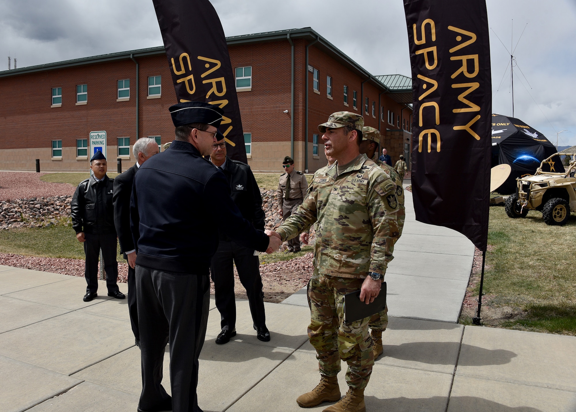 Col. Mark Cobos, commander, 1st Space Brigade, U.S. Army Space and Missile Defense Command, thanks Chief of Space Operations U.S. Space Force Gen. Chance Saltzman and Chief Master Sgt. of the Space Force John F. Bentivegna for visiting the brigade headquarters at Fort Carson, Colo., April 10.