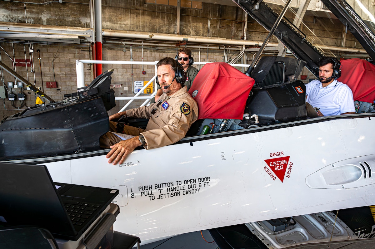 William Gray, Chief Test Pilot, USAFTPS, and other engineers conduct software updates to the X-62 VISTA at Edwards Air Force Base, California, Aug. 3, 2022. (Air Force photo by Giancarlo Casem)