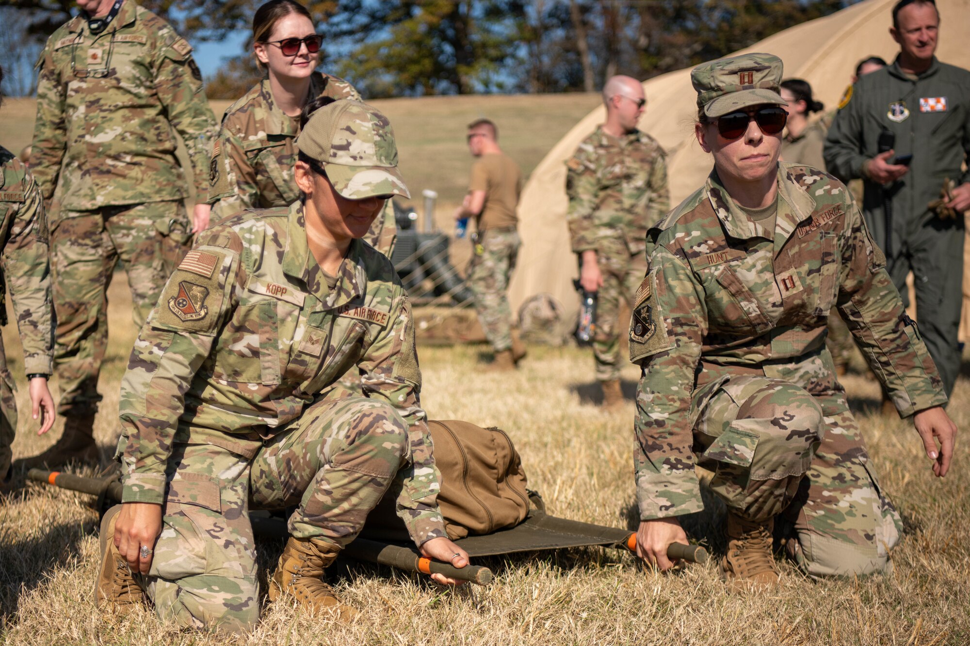 Airmen prepare to lift stretcher