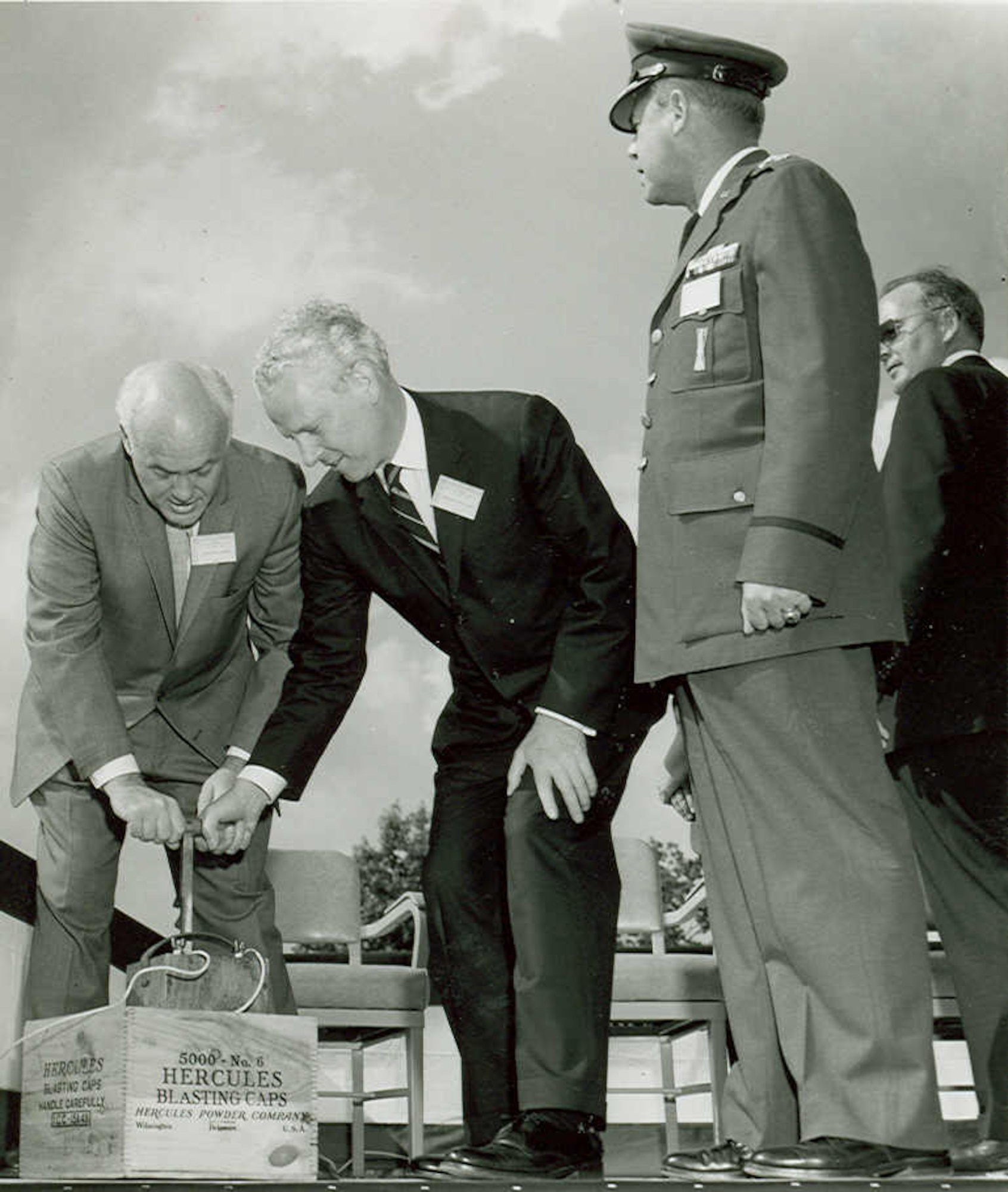 This image shows then-Air Force Secretary Eugene Zuckert and Sen. Albert Gore preparing to push the plunger June 23, 1961, to set off a blast to begin construction of a test cell at Arnold Air Force Base, Tenn., as then-Arnold Engineering Development Center Commander Maj. Gen. William Rogers looks on. A photo of the trio’s reaction after the plunger was pushed was featured on the frontpage of the July 1961 issue of High Mach. (U.S. Air Force photo)