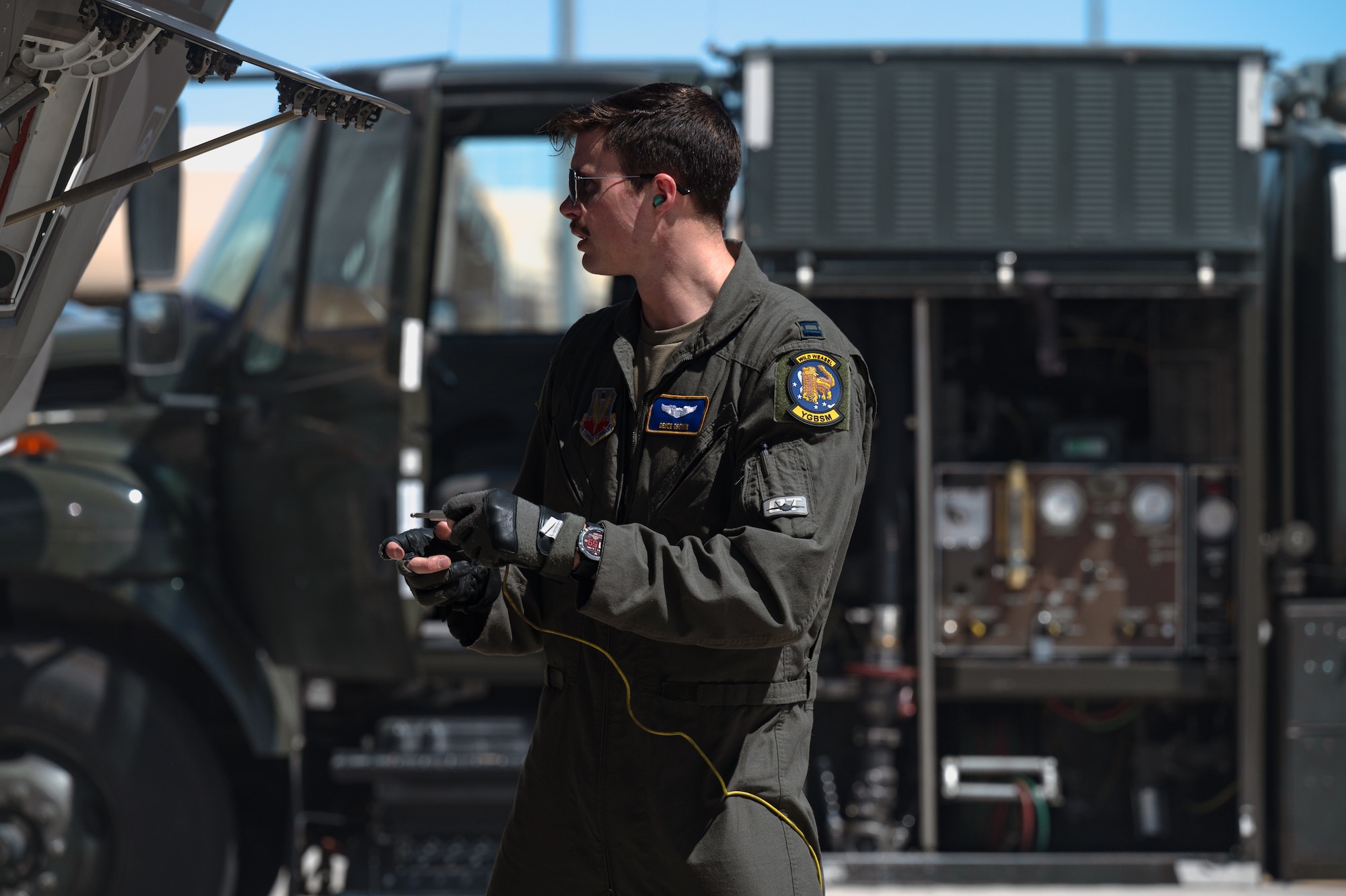 U.S. Air Force Capt. Matthew Brown, an F-35 assistant program manager assigned to the 59th Test and Evaluation Squadron, prepares an F-35 Lightning II to be refueled in support of independent pilot off-station procedures (IPOP) at Nellis Air Force Base, Nevada, April 1, 2024.