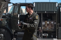 U.S. Air Force Capt. Matthew Brown, an F-35 assistant program manager assigned to the 59th Test and Evaluation Squadron, prepares an F-35 Lightning II to be refueled in support of independent pilot off-station procedures (IPOP) at Nellis Air Force Base, Nevada, April 1, 2024.