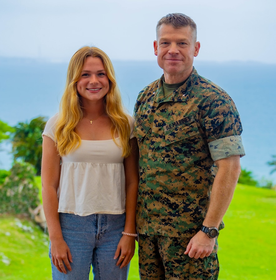 Brig. Gen. Trevor Hall, the commanding general of the 3rd Marine Expeditionary Brigade, poses with his daughter, Olivia, on Camp Courtney, Okinawa, Japan, April 12, 2024. The Month of the Military Child, celebrated annually in April, recognizes military children for the daily sacrifices and challenges they overcome. (U.S. Marine Corps photo by 1st Lt. Samuel H. Barge)