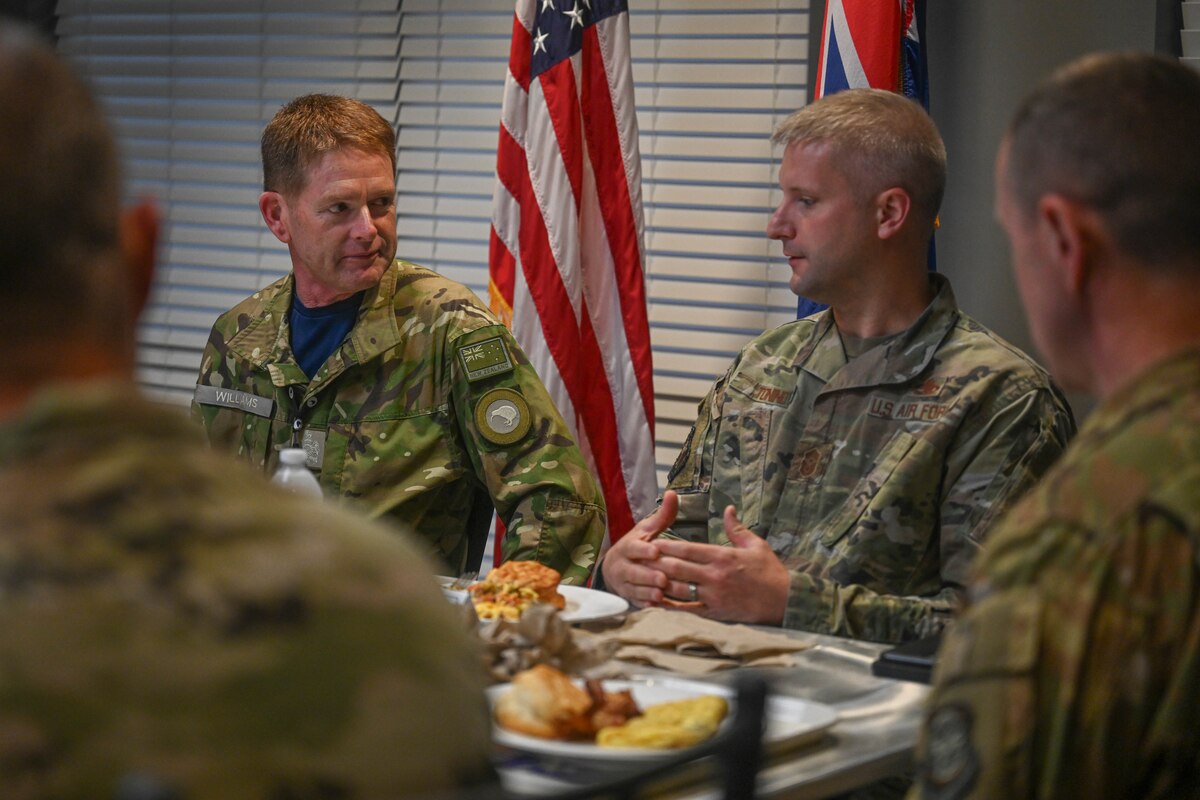Royal New Zealand Air Force Warrant Officer of the Air Force Kerry Williams talks with Chief Master Sgt. Nicolas Tonino, 19th Airlift Wing command chief, at Little Rock Air Force Base, Arkansas, April 16, 2024. Williams visited the RNZAF troops at Little Rock AFB to inform about new policies, procedures and events happening in New Zealand. (U.S. Air Force photo by Airman 1st Class Saisha Cornett)