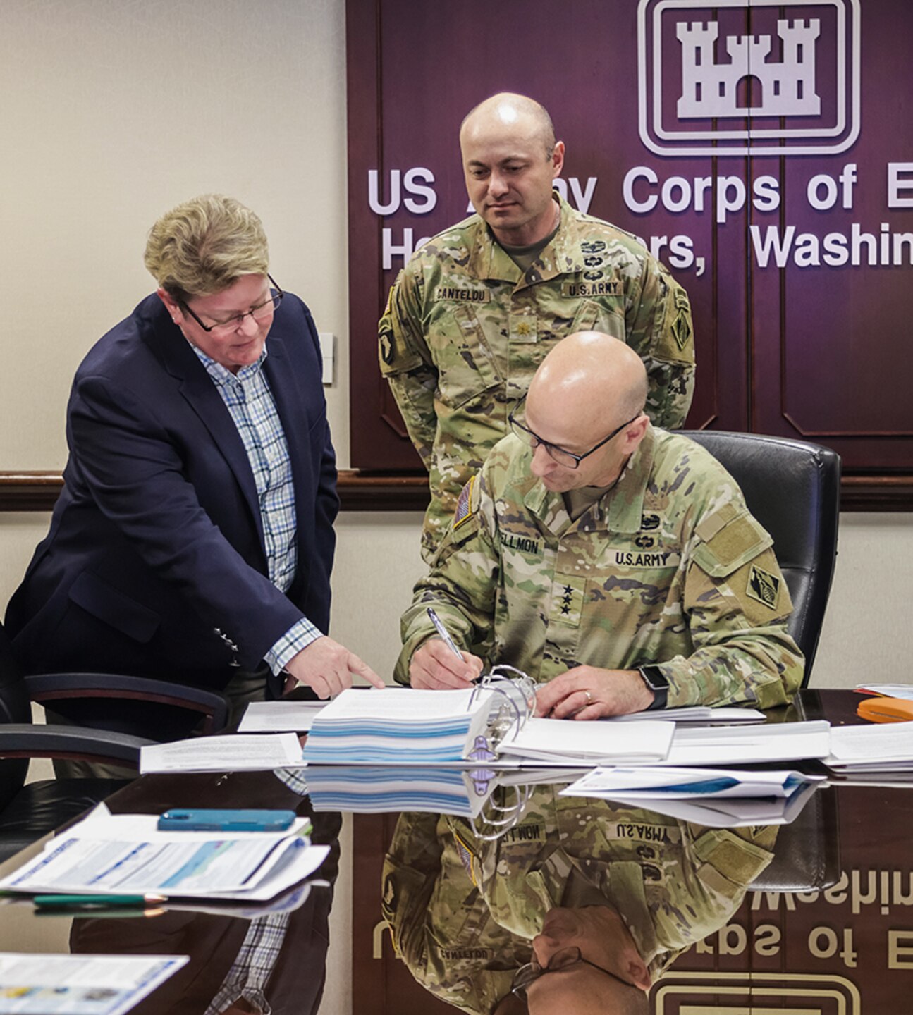 LTG Spellmon signs the PVB CSRM Chief's Report April 18, 2024.