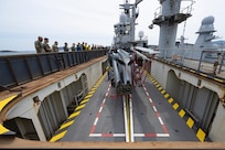 A MH-60R Seahawk, assigned to the “Griffins” of Helicopter Maritime Strike Squadron (HSM 79), is raised on a helicopter elevator during a Strategic Interoperability Framework (SIF) testing, aboard French Navy amphibious assault ship, LHD Dixmude (L9015), Apr. 16, 2024. SIF is a living, scalable plan aimed at ensuring high-end warfighting interoperability exists between the U.S. Navy and the Marine Nationale.