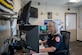 Darlene Magdaleno, emergency dispatcher, 812th Civil Engineer Squadron, operates an emergency dispatch station on Edwards Air Force Base, California, April 15. (Air Force photo by Giancarlo Casem)