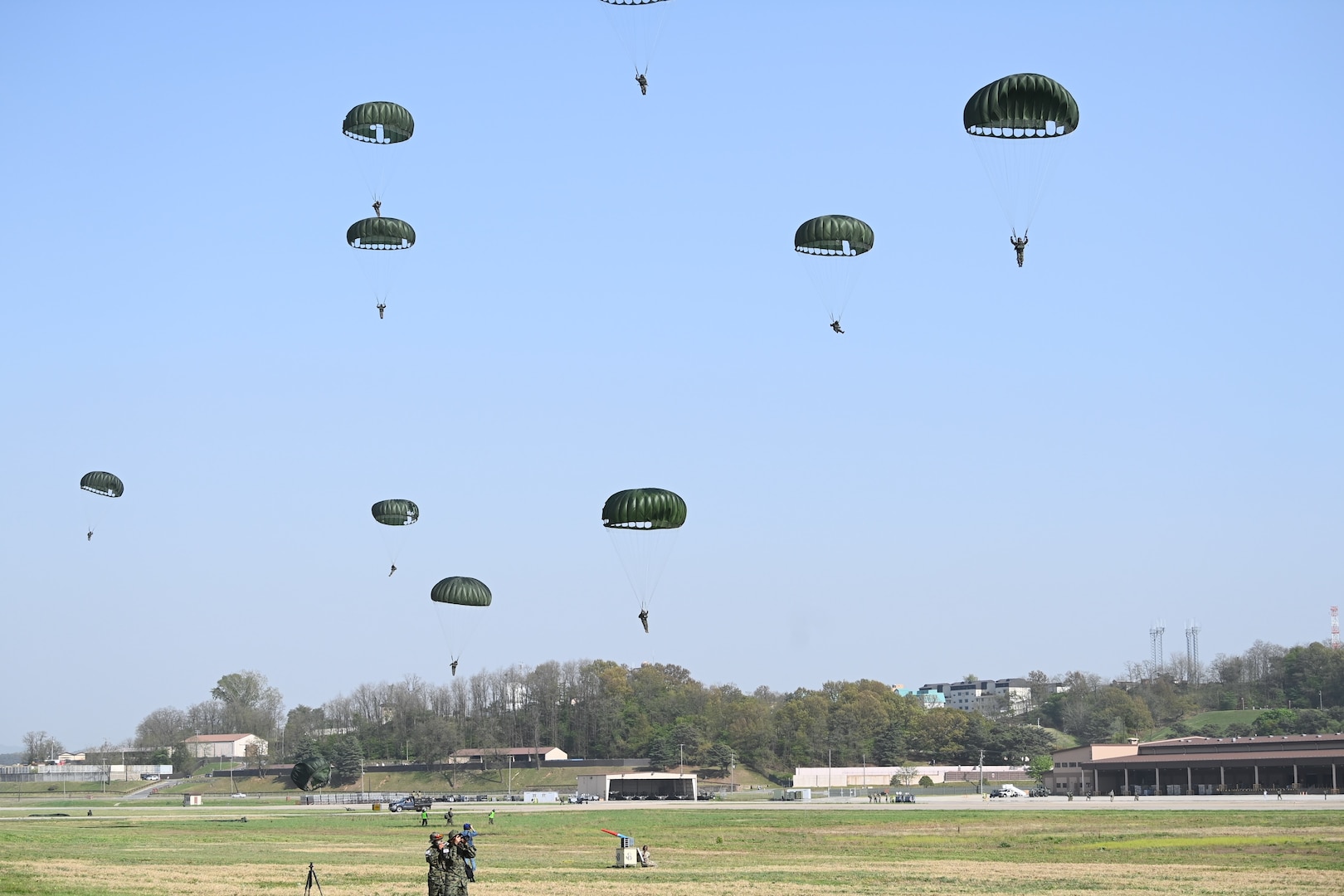 Special operations forces personnel land on a drop zone during a training event at Osan Air Base, Republic of Korea, April 18, 2024. Approximately 300 U.S. and Republic of Korea special operations forces personnel participated in a static-line Airborne training operation as part of Korea Flying Training 24, a combined ROK and U.S. exercise running April 12-26. (U.S. Air Force photo by Master Sgt. Eric Burks)