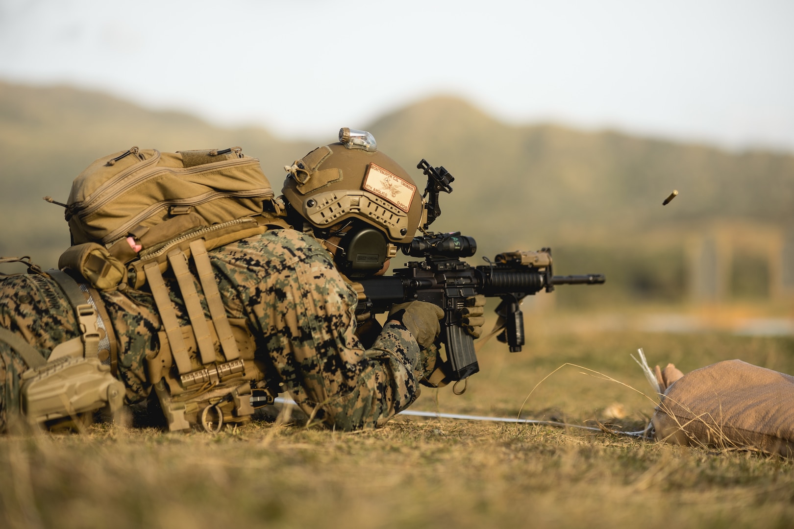 U.S. Marine Corps Lance Cpl. Christian Montemayor, a fire support Marine, with 5th Air Naval Gunfire Liaison Company, III Marine Expeditionary Force Information Group, fires an M4 carbine during a Marine Corps Combat Marksmanship Program range as part of 2nd Brigade Platoon’s field exercise on Camp Hansen, Okinawa, Japan, Feb. 14, 2024. This CMP allows Marines to maintain weapon proficiency by engaging targets in a stress-induced environment with primary and secondary weapon systems. 5th ANGLICO Marines refined their marksmanship fundamentals that enhanced their lethality through advanced marksmanship training. Montemayor is a native of San Diego. (U.S. Marine Corps photo by Staff Sgt. Manuel A. Serrano)