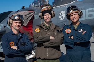 Three plane captains pose for a photo.