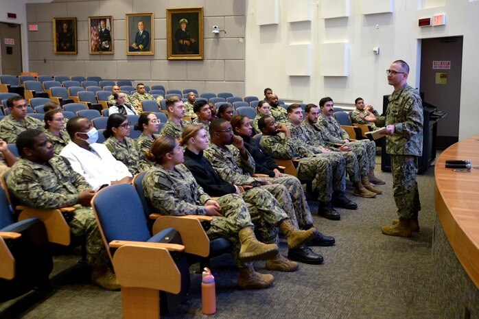 U.S. Navy Master Chief Hospital Corpsman Carlos Rodriguez, Navy Bureau of Medicine and Surgery’s Independent Duty Corpsman program manager, talks with Sailors during a Navy Enlisted Classifications roadshow at Naval Medical Center San Diego, Apr. 18, 2024.  The NEC roadshow focuses on giving Sailors the knowledge and tools to pursue opportunities within their rate to include Dive Medicine and other specialized assignments. NMCSD continuously seeks professional civilian talent, not just limited to health care providers and administrative support. For anyone seeking a federal job, visit USAJobs at usajobs.gov - the Federal Government's official employment site.  The mission of NMCSD is to prepare service members to deploy in support of operational forces, deliver high quality health care services, and shape the future of military medicine through education, training, and research. NMCSD employs more than 5,000 active-duty military personnel, civilians and contractors in southern California to provide patients with world-class care. Anchored in Excellence, Committed to Health! (U.S. Navy photo by Mass Communication Specialist 2nd Class Jacob Woitzel)