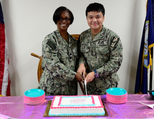 (April 15, 2024)  U.S. Navy Capt. Adrian Gaskin, left, and Hospitalman Markjustine Esmeralda, right, cut a cake during the Medical Laboratory Professionals Week celebration at Naval Medical Center San Diego (NMCSD), April 15, 2024. The mission of NMCSD is to prepare service members to deploy in support of operational forces, deliver high quality health care services, and shape the future of military medicine through education, training, and research. NMCSD employs more than 5,000 active-duty military personnel, civilians and contractors in southern California to provide patients with world-class care. Anchored in Excellence, Committed to Health!  (U.S. Navy photo by Mass Communication Specialist 2nd Class Celia Martin)