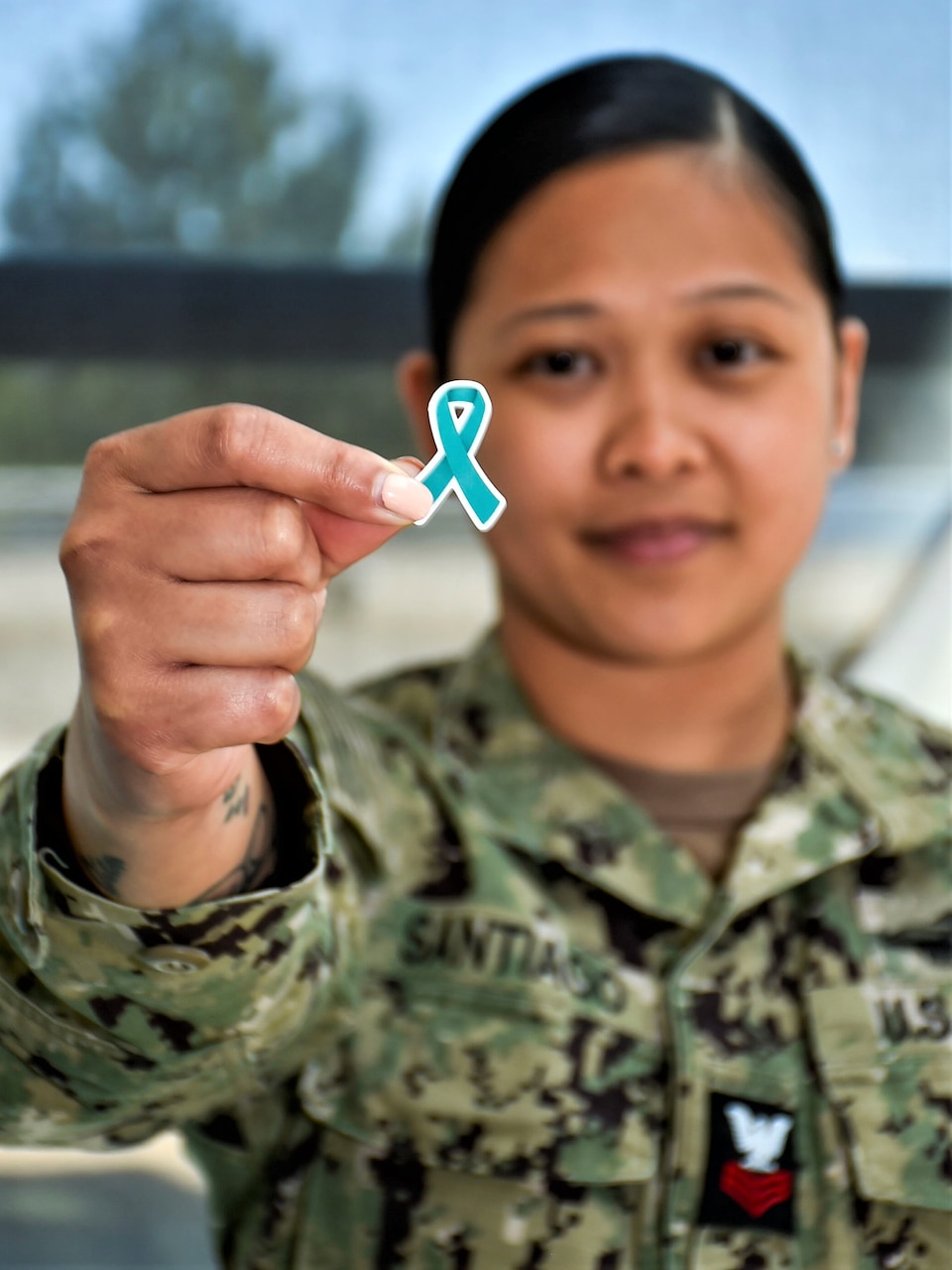 Teal up for sexual assault awareness and prevention… Hospital Corpsman 1st Class Robediane G. Santiago, assigned to Navy Medicine Readiness and Training Command Bremerton, advocates for all staff to wear a teal ribbon to indicate their support and help bring awareness to widespread occurrences of sexual assault and harassment. Santiago is also a Sexual Assault Prevention Response team victim advocate, taking on the crucial collateral duty to be there for others in need (Official Navy photo by Mass Communication Specialist 2nd Class Jennifer Benedict, NHB/NMRTC Bremerton public affairs office).