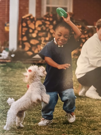 Boy playing with dog