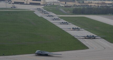 B-2 Spirit stealth bombers assigned to the 509th Bomb Wing taxi on the runway at Whiteman Air Force Base, Mo., April 15, 2024. Team Whiteman executed a mass fly-off of 12 B-2s to cap off the annual Spirit Vigilance exercise. Routine training ensures that Airmen are always ready to execute global strike operations… anytime, anywhere. (U.S. Air Force photo by Airman 1st Class Hailey Farrell)