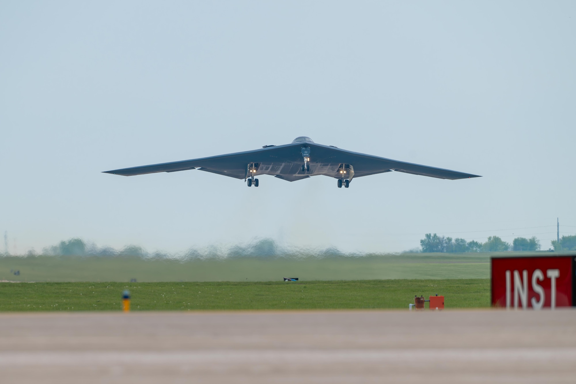 A B-2 Spirit stealth bomber assigned to the 509th Bomb Wing takes off at Whiteman Air Force Base, Mo., April 15, 2024. Team Whiteman executed a mass fly-over of 12 B-2 Spirit stealth bombers to cap off the annual Spirit Vigilance exercise. Routine training ensures that Airmen are always ready to execute global strike operations… anytime, anywhere.. (U.S. Air Force photo by Airman 1st Class Matthew S. Domingos)