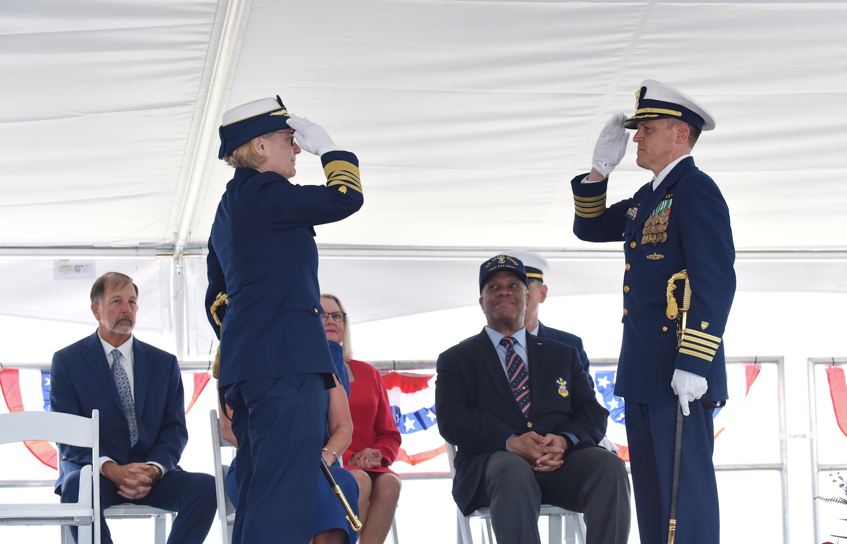 Coast Guard Commandant Adm. Linda Fagan and Capt. Timothy Sommella, commanding officer of U.S. Coast Guard Cutter Calhoun (WMSL 759), salute one another during the cutter's commissioning ceremony, April 20, 2024, in North Charleston, South Carolina. The Calhoun, which is named for the first Master Chief Petty Officer of the Coast Guard, Charles Calhoun, was commissioned into service as the 10th National Security Cutter. (U.S. Coast Guard photo by Petty Officer 2nd Class Brandon Hillard)
