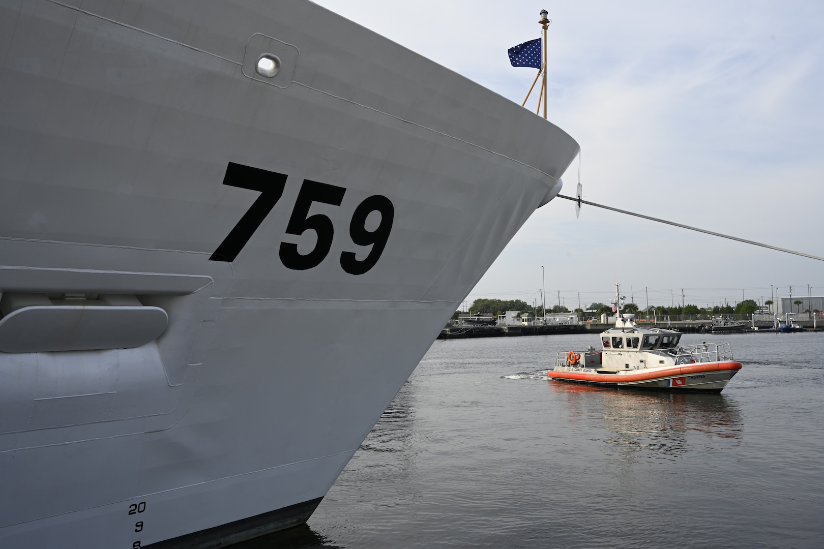 A boat crew from Coast Guard Station Charleston patrols near the Coast Guard Cutter Calhoun (WMSL 759) in North Charleston, South Carolina, April 20, 2024. The Calhoun, which is named for the first Master Chief Petty Officer of the Coast Guard, Charles Calhoun, was commissioned into service as the 10th National Security Cutter. (U.S. Coast Guard photo by Senior Chief Petty Officer Nick Ameen)