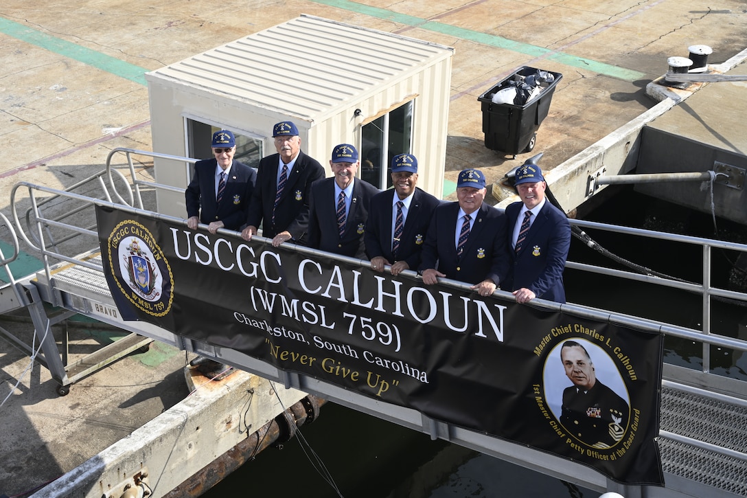 Former Master Chief Petty Officers of the Coast Guard stand on the brow of the Coast Guard Cutter Calhoun (WMSL 759), which is named for the first Master Chief Petty Officer of the Coast Guard (MCPOCG), Charles Calhoun, April 20, 2024, in North Charleston, South Carolina. From left, MCPOCG #3 Hollis Stephens, MCPOCG #6 Jay Lloyd, MCPOCG #7 Eric Trent, MCPOCG #8 Vince Patton, MCPOCG #10 Skip Bowen, and MCPOCG #13 Jason Vanderhaden. (U.S. Coast Guard photo by Senior Chief Petty Officer Nick Ameen)