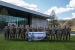 The 24 participants of the 2024 Best Warrior Competition for the West Virginia National Guard, pose for a group photo at Camp Dawson, West Virginia April 20, 2024. Soldiers and Airmen from the West Virginia National Guard and District of Columbia National Guard compete in the West Virginia National Guard Best Warrior Competition April 19-21, 2024, at Camp Dawson in Kingwood, West Virginia. The Best Warrior Competition is an annual event where participants compete in a series of warrior training tasks including weapons proficiency on the M4 rifle, 9mm pistol, land navigation, physical fitness, combat first aid, tactical movements, communications, and professional development activities. (West Virginia National Guard photo by Sgt. Davis Rohrer)