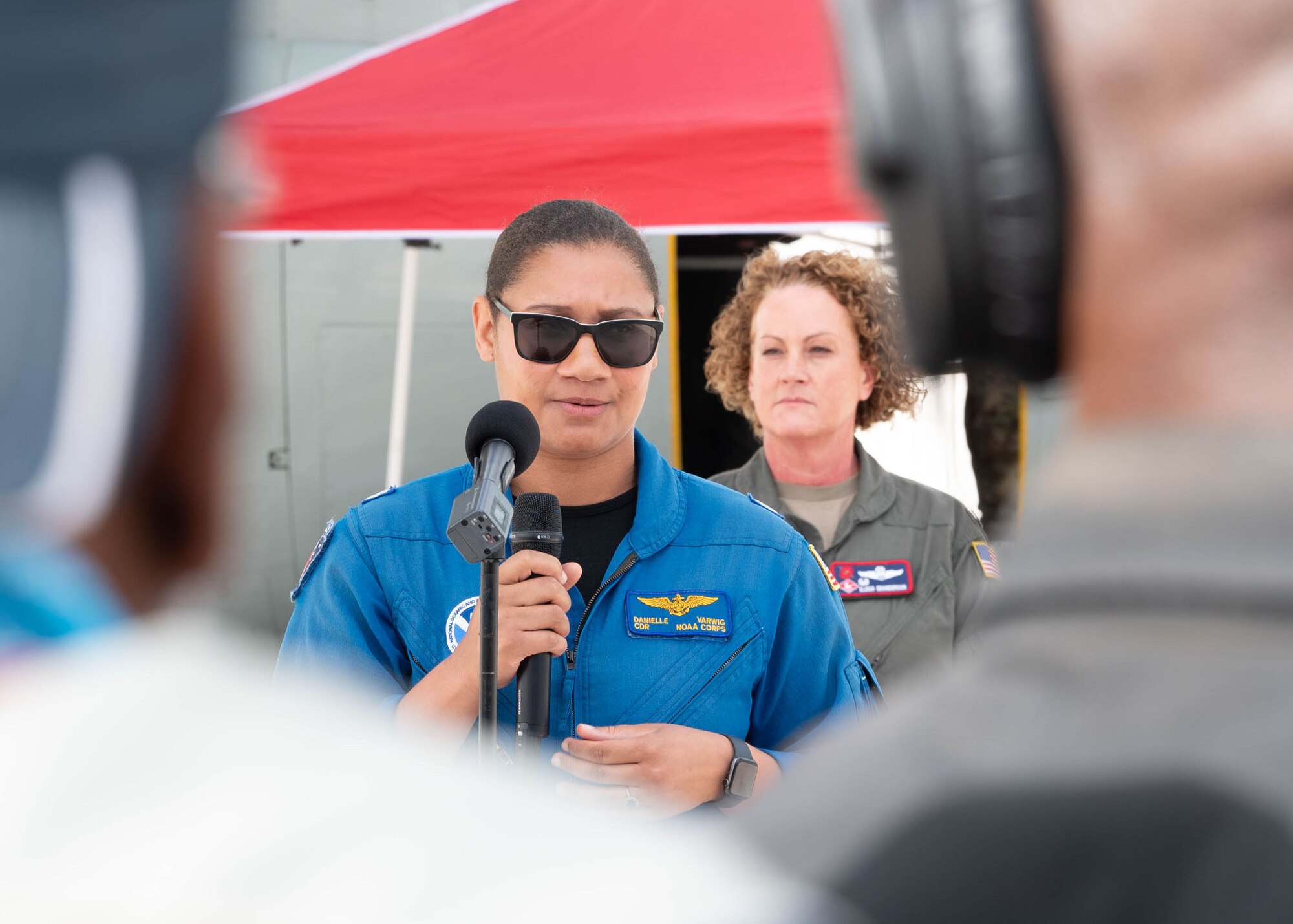 Woman talking to media