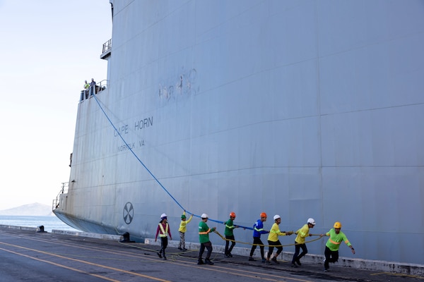 Stevedores at the New Container Terminal, Subic Bay, Philippines, begin mooring MSC chartered ship MV Cape Horn (T-AKR 5068) before an offload of equipment in support of exercise Balikatan 2024, April 15. Balikatan is a longstanding annual exercise between the Armed Forces of the Philippines and the U.S. military designed to strengthen bilateral capabilities, interoperability, trust, and cooperation. (U.S .Navy photo by Grady T. Fontana)