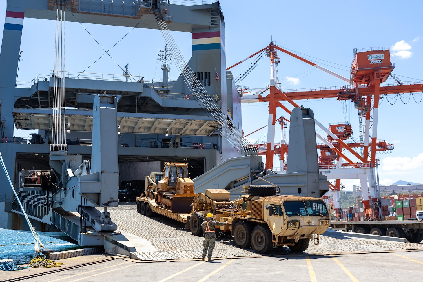 A military vehicle is driven out of Military Sealift Command chartered ship MV Cape Horn (T-AKR 5068) during an offload for exercise Balikatan 2024 at the New Container Terminal, Subic Bay, Philippines, April 15. Balikatan is a longstanding annual exercise between the Armed Forces of the Philippines and the U.S. military designed to strengthen bilateral capabilities, interoperability, trust, and cooperation. (U.S. Navy photo by Grady T. Fontana)