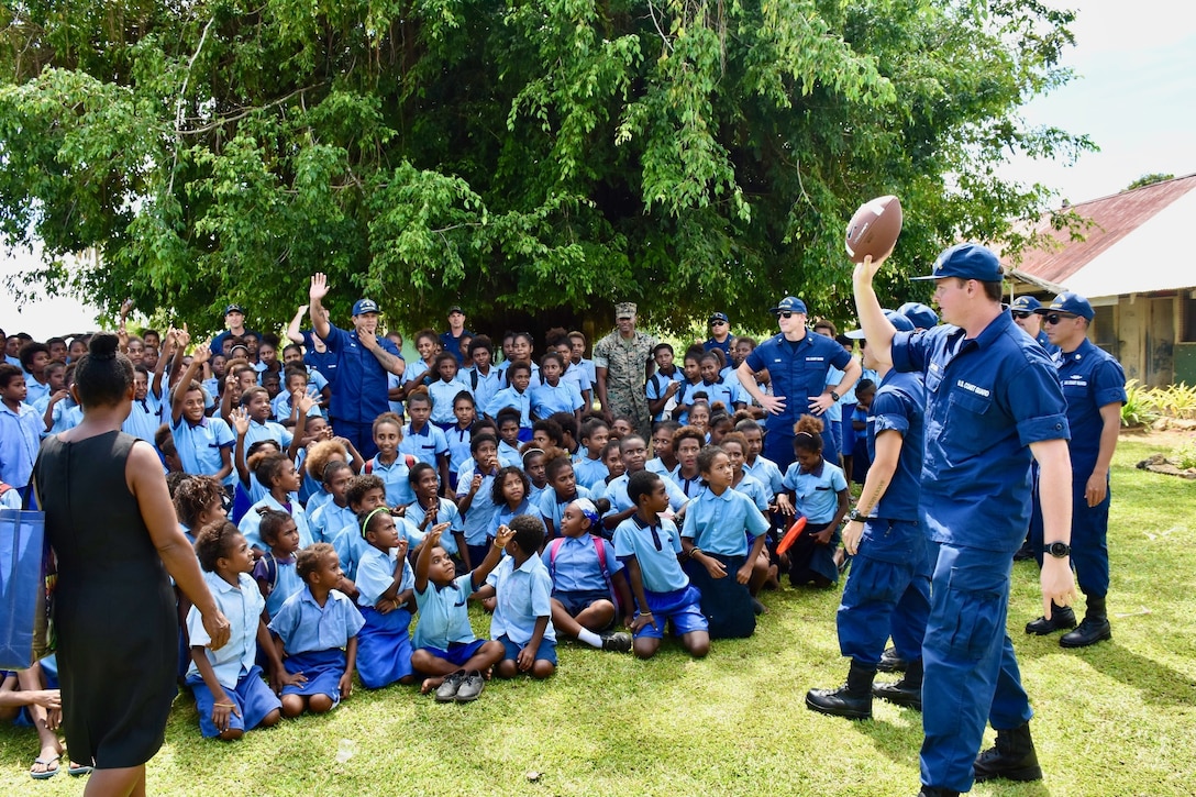 The USCGC Oliver Henry (WPC 1140) crew spends time with students at HMPNGS Tarangau School in Manus, Papua New Guinea, Aug. 15, 2022. The U.S. Coast Guard is participating with partners to support the Operation Blue Pacific through patrols in the Western Pacific in August and September 2022. (U.S. Coast Guard photo by USCGC Oliver Henry)