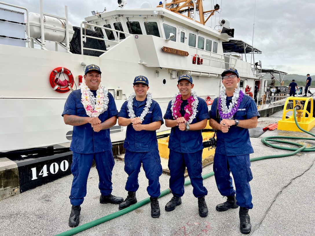 The Sentinel-class fast response cutter USCGC Oliver Henry (WPC 1140) returns to homeport in Apra Harbor Sept. 19, 2022, following a 43-day patrol across Oceania. Left to right: Petty Officer 1st Class Luis Jose Blas of the Maintenance Assistance Team Guam, Petty Officer 1st Class Joshua Pablo of Oliver Henry, Petty Officer 2nd Class Ben Laguana of Oliver Henry, and Petty Officer 2nd Class Sean Ray Blas of U.S. Coast Guard Forces Micronesia Sector Guam stand for a photo. The Blases supplemented the Oliver Henry crew. All four are proud Chamorros and place one fist (tasa) over the other (haligi) to make the symbol of a Latte Stone a symbol of Chamorro strength. (U.S. Coast Guard photo by Chief Warrant Officer Sara Muir)