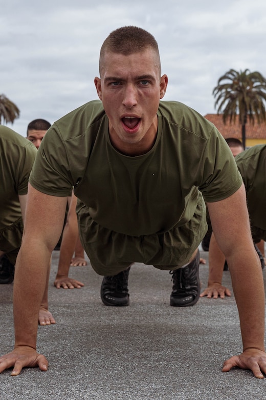 A Marine Corps recruit performs pushups.