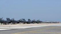 Republic of Korea Air Force F-15K Slam Eagles and FA-50 Golden Eagles parked on the airfield at Kunsan Air Base, ROK