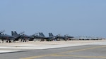 Republic of Korea Air Force F-15K Slam Eagles and FA-50 Golden Eagles parked on the airfield at Kunsan Air Base, ROK, April 12, 2024. ROKAF follow-on forces arrived from across the country to participate in Korea Flying Training 2024. (U.S. Air Force photo by Staff Sgt. Nicholas Ross)