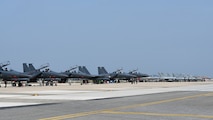 Republic of Korea Air Force F-15K Slam Eagles and FA-50 Golden Eagles parked on the airfield at Kunsan Air Base, ROK