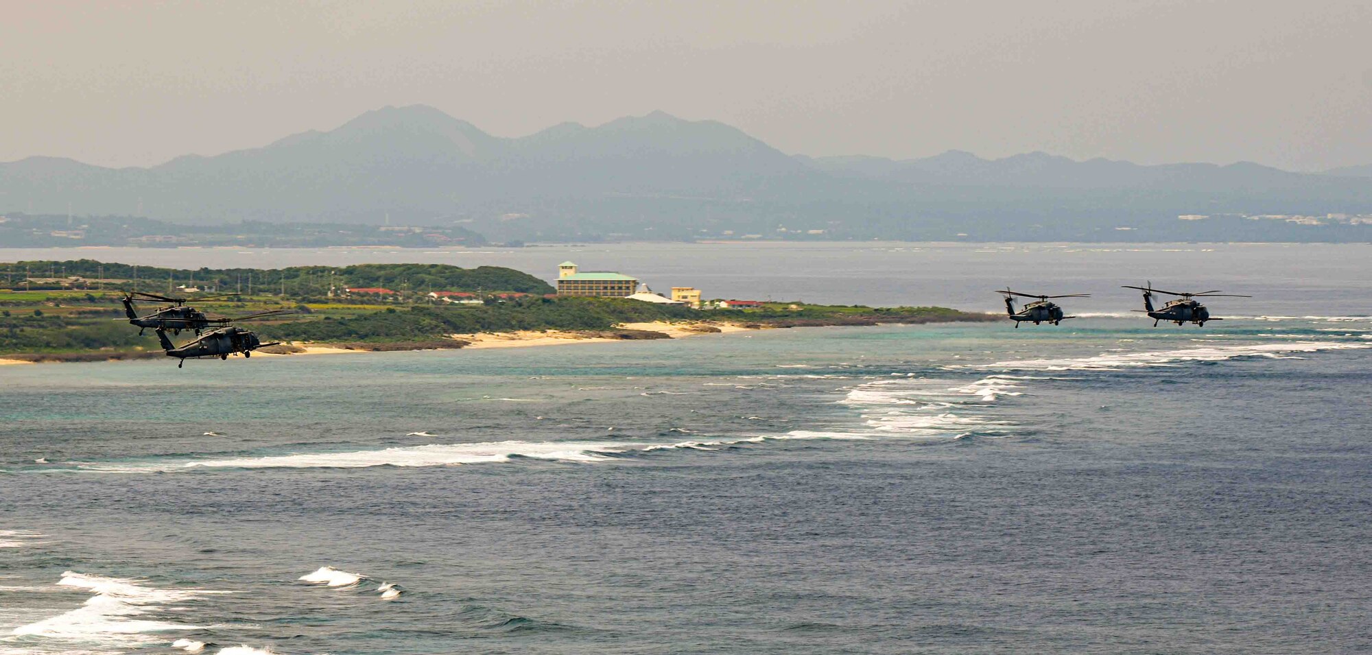 U.S. Air Force HH-60G Pave Hawks assigned to the 33rd Rescue Squadron fly in formation over Okinawa, Japan, April 16, 2024.