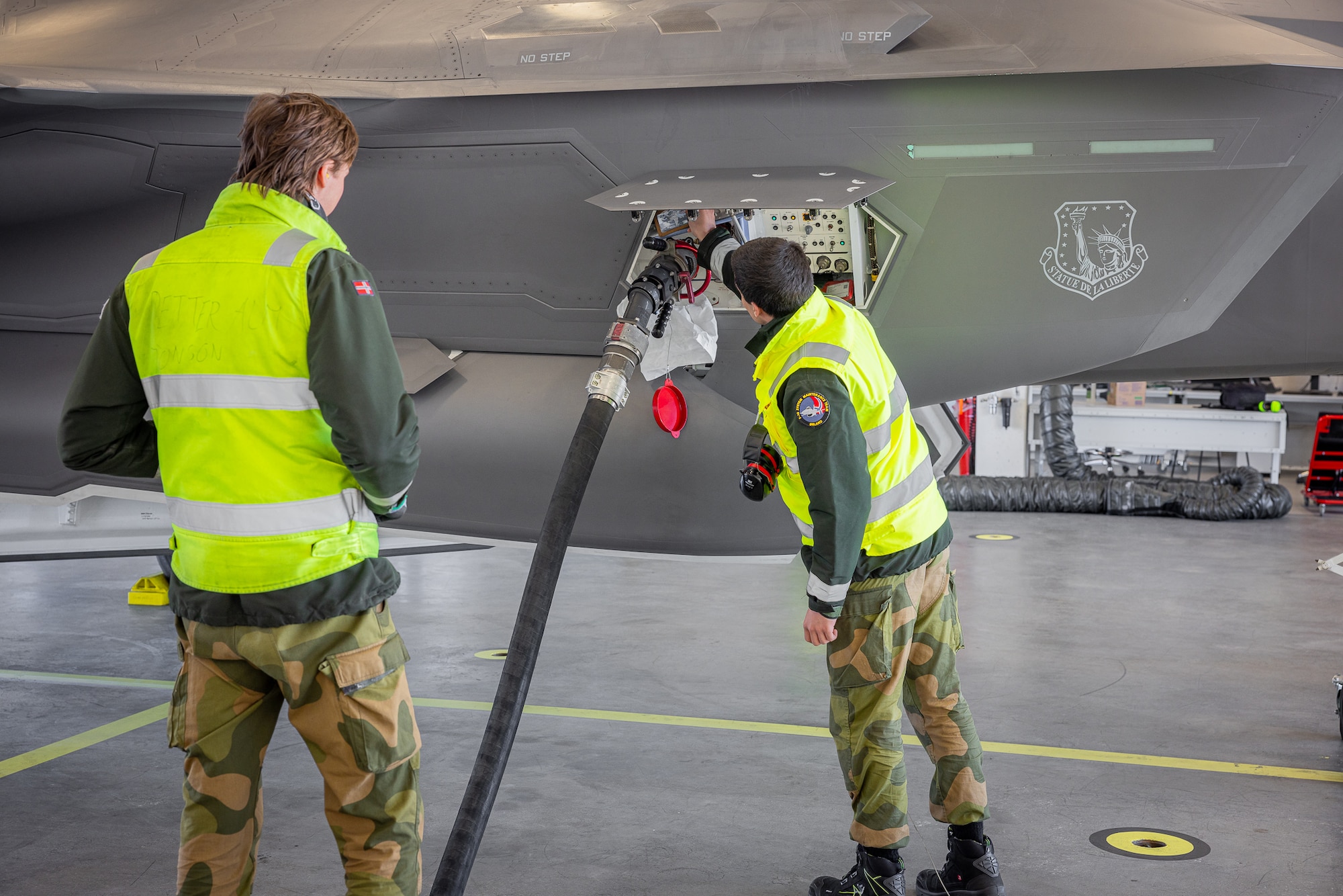 Airmen with the Royal Norwegian Air Force refuel a U.S. F-35 Lightning II at Ørland Air Station in Norway, April 8, 2024. The mission marked the first time that Airmen from one nation’s military provided servicing to another nation’s F-35 aircraft without supervision. The cross servicing of aircraft between NATO partners highlights the future interoperability with fellow F-35 users across the European Theater. (RNoAF photo by Ole Andreas Vekve)