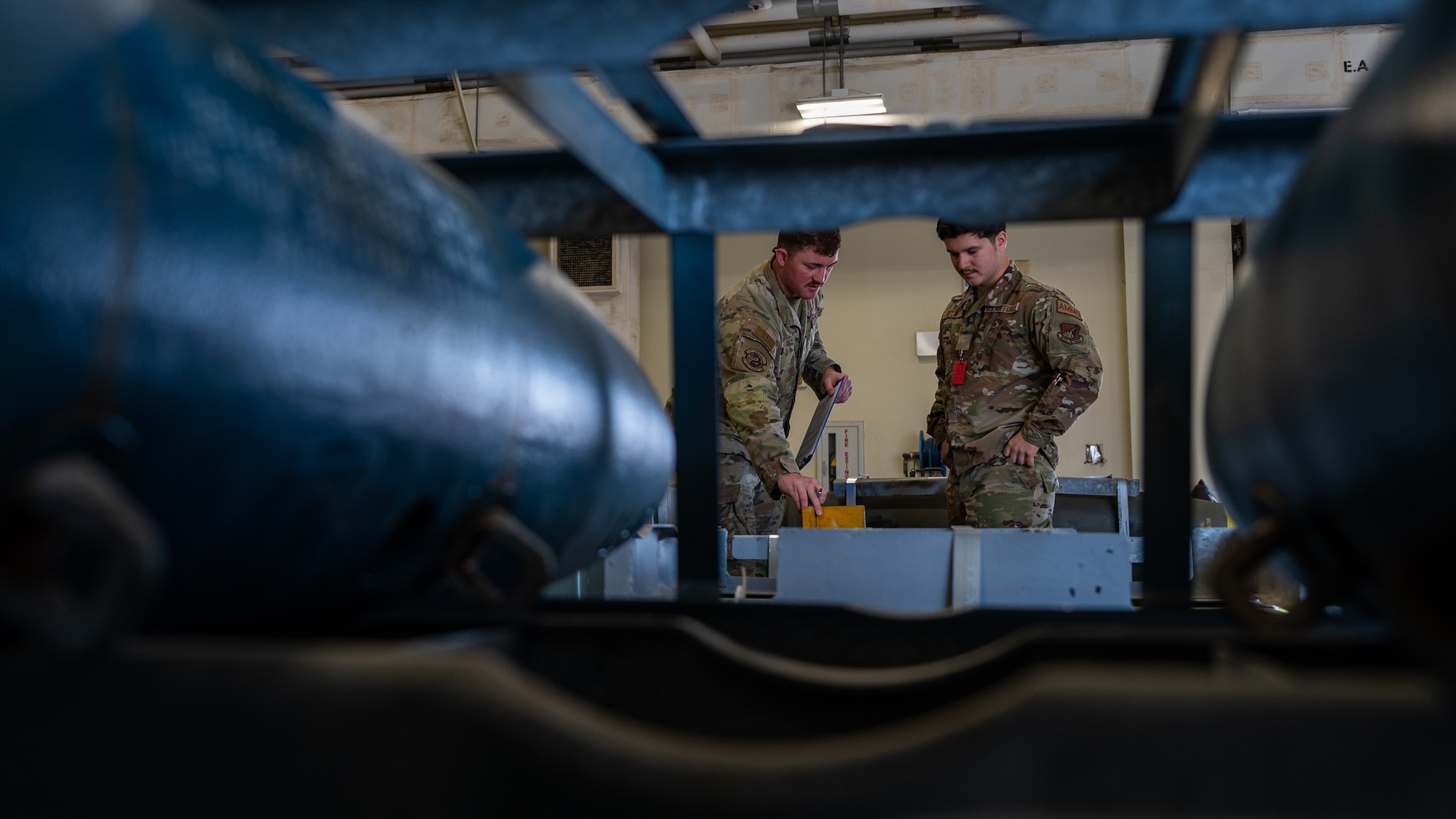 Staff Sgt. Rylee Barton, left and Airman Basic Tyler Gatlin onduct inventory of current munitions during Korea Flying Training 2024.