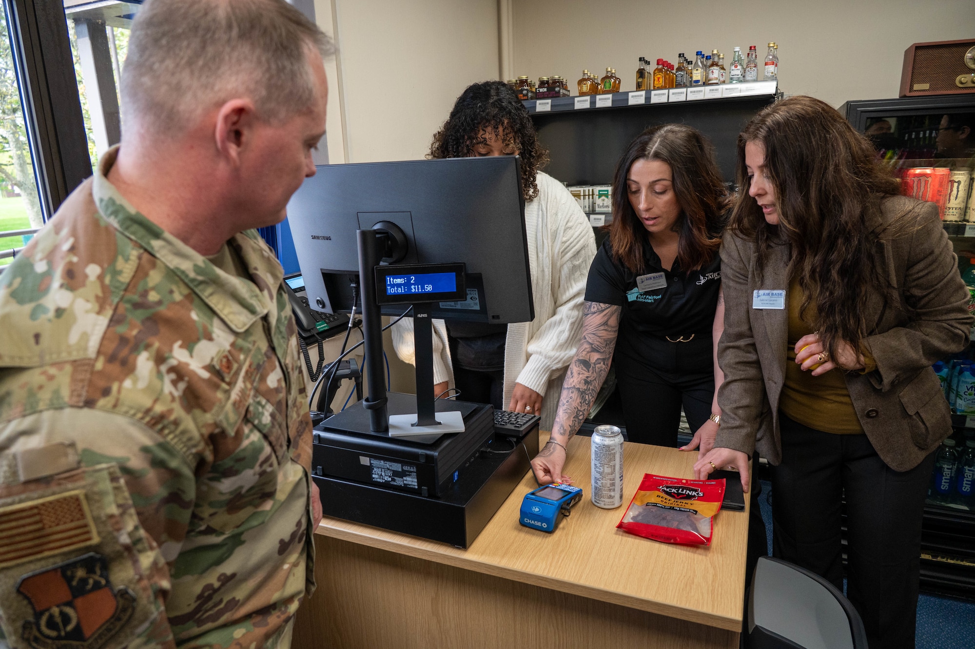 Airman makes the first official purchase from the newly opened Mini-Mart