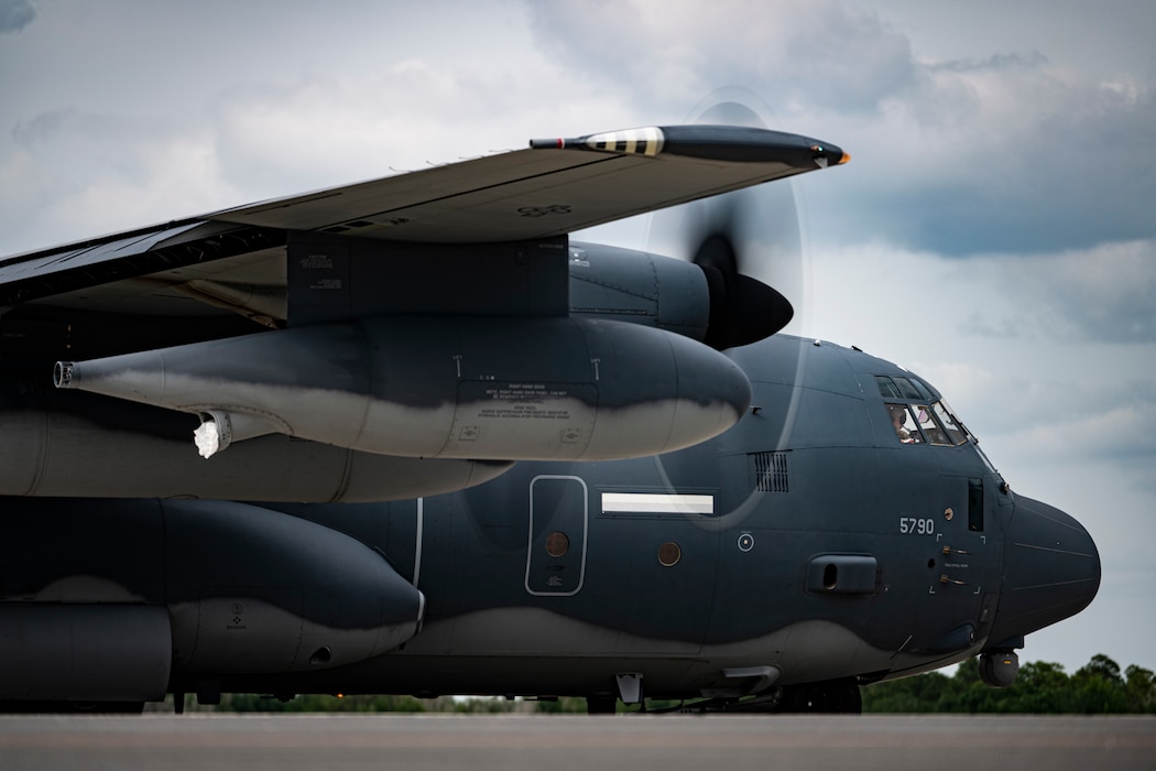 U.S. Air Force pilots park an HC-130J Combat King II for a personnel and cargo offload