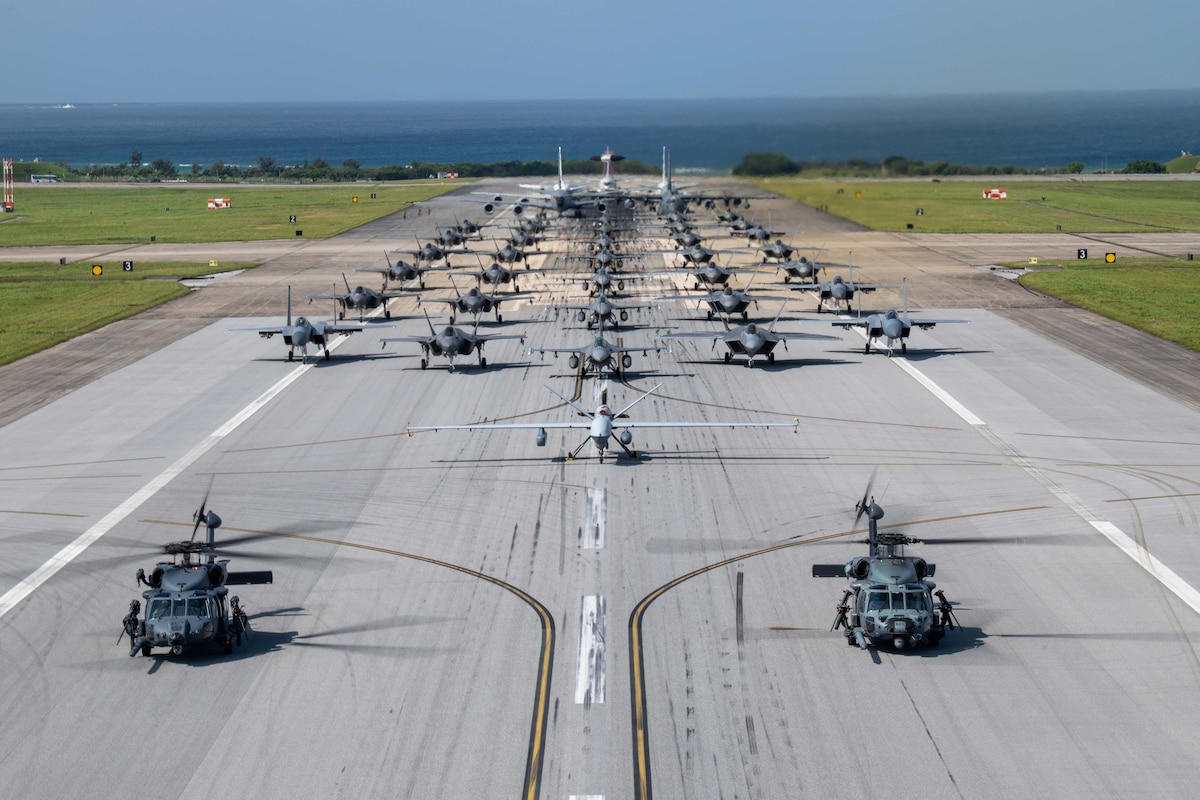 U.S. Air Force and Navy aircraft, including an HH-60W Jolly Green II, HH-60G Pave Hawk, MQ-9 Reaper, F-16 Fighting Falcons, F-22 Raptors, F-35A Lightning IIs, F-15C Eagles, a RC-135 Rivet Joint, KC-135 Stratotankers, a Navy P8 Poseidon and an MC-130J Commando II, line up on the runway during an elephant walk at Kadena Air Base, Japan, April 10, 2024. Directly after the elephant walk, the aircrew launched into a large force exercise to strengthen their readiness to defend Japan. (U.S. Air Force photo by Airman 1st Class Alexis Redin)