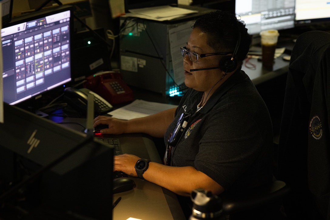 Lisa Moran, supervisory 911 dispatcher, Security Emergency Services, takes a call on Marine Corps Base Camp Lejeune, North Carolina, April 9, 2024. During the month of April, National Public Safety Telecommunicators Week is held to honor personnel in the public safety sector for their dedicated service to the community. (U.S. Marine Corps photo by Cpl. Jennifer E. Douds)