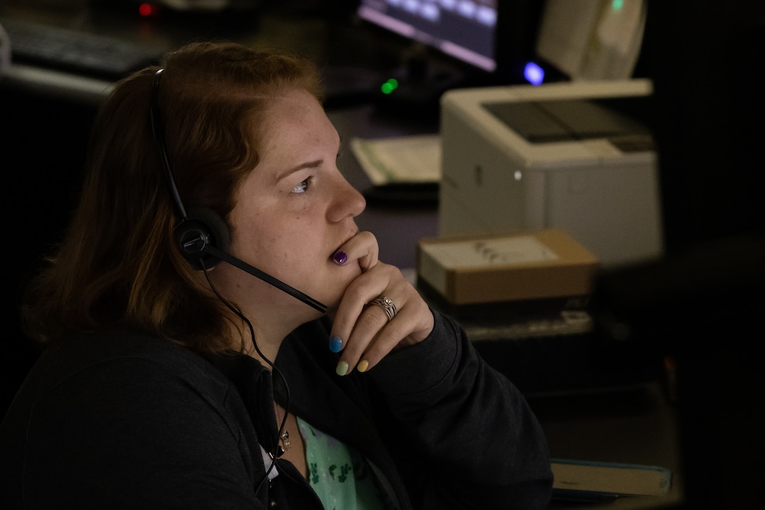 Amber Penland, 911 dispatcher, Security Emergency Services, takes a call on Marine Corps Base Camp Lejeune, North Carolina, April 9, 2024. During the month of April, National Public Safety Telecommunicators Week is held to honor personnel in the public safety sector for their dedicated service to the community. (U.S. Marine Corps photo by Cpl. Jennifer E. Douds)