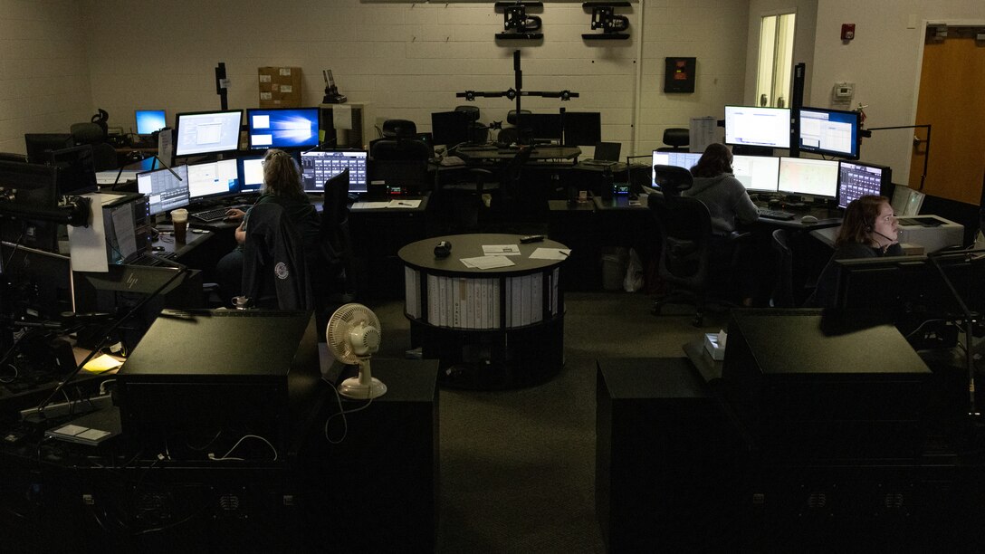 Dispatchers with Security Emergency Services work at their stations on Marine Corps Base Camp Lejeune, North Carolina, April 9, 2024. During the month of April, National Public Safety Telecommunicators Week is held to honor personnel in the public safety sector for their dedicated service to the community. (U.S. Marine Corps photo by Cpl. Jennifer E. Douds)