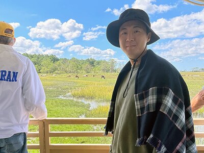 Sgt. Wang Geun Lee at a horse ranch for therapy