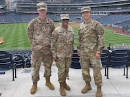 Sgt. Wang Geun Lee with fellow soldiers at baseball game