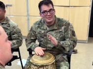 Spc. Joaquin Pina is participating in music therapy at the Fort Drum SRU.